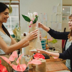 Woman buying flowers at a local flower shop