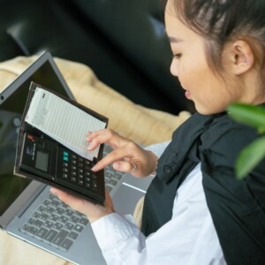 woman working on a calculator