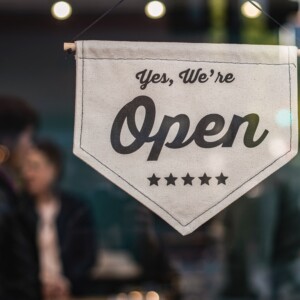 Yes, We're Open Sign in Business Window