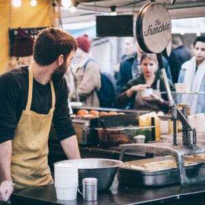 Man working the counter at a cafe