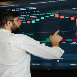 Man pointing to big digital screen